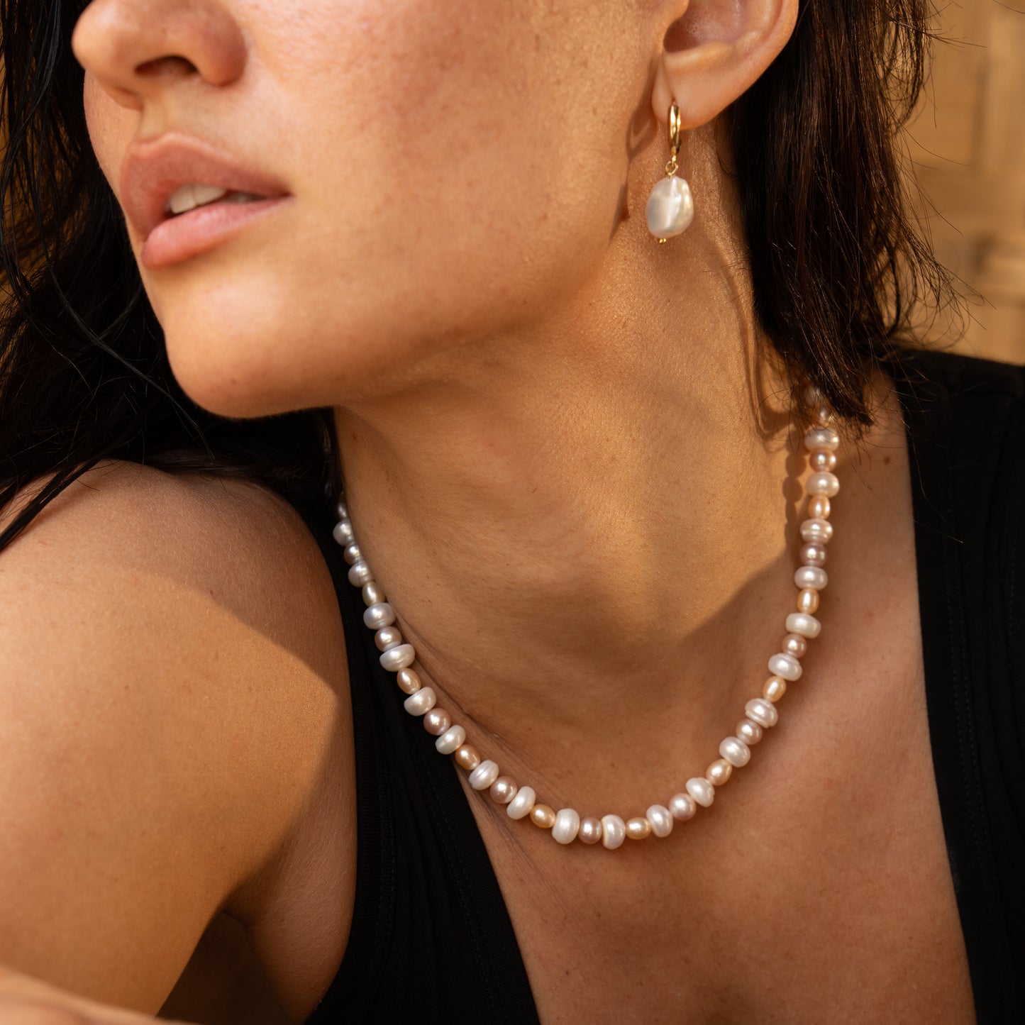 MABE necklace from After-Sun Hours, a strand of peach and pink pearls.