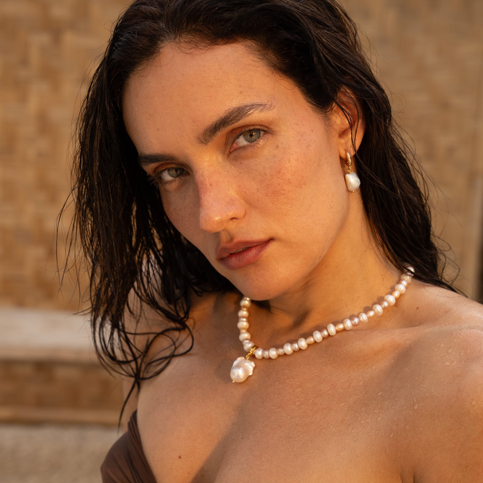 NALU charm from After-Sun Hours, a single baroque pearl on a removable clasp.