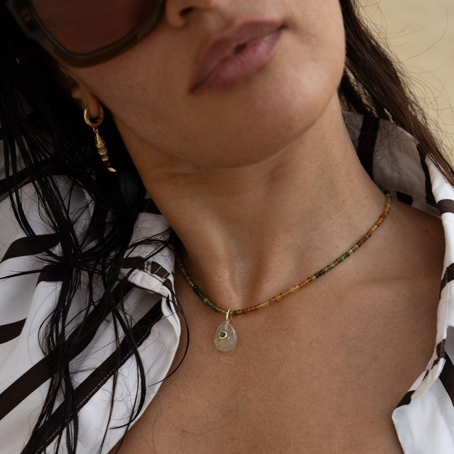 NONI necklace from After-Sun Hours, beads shading from green to gold with a soft green pendant.