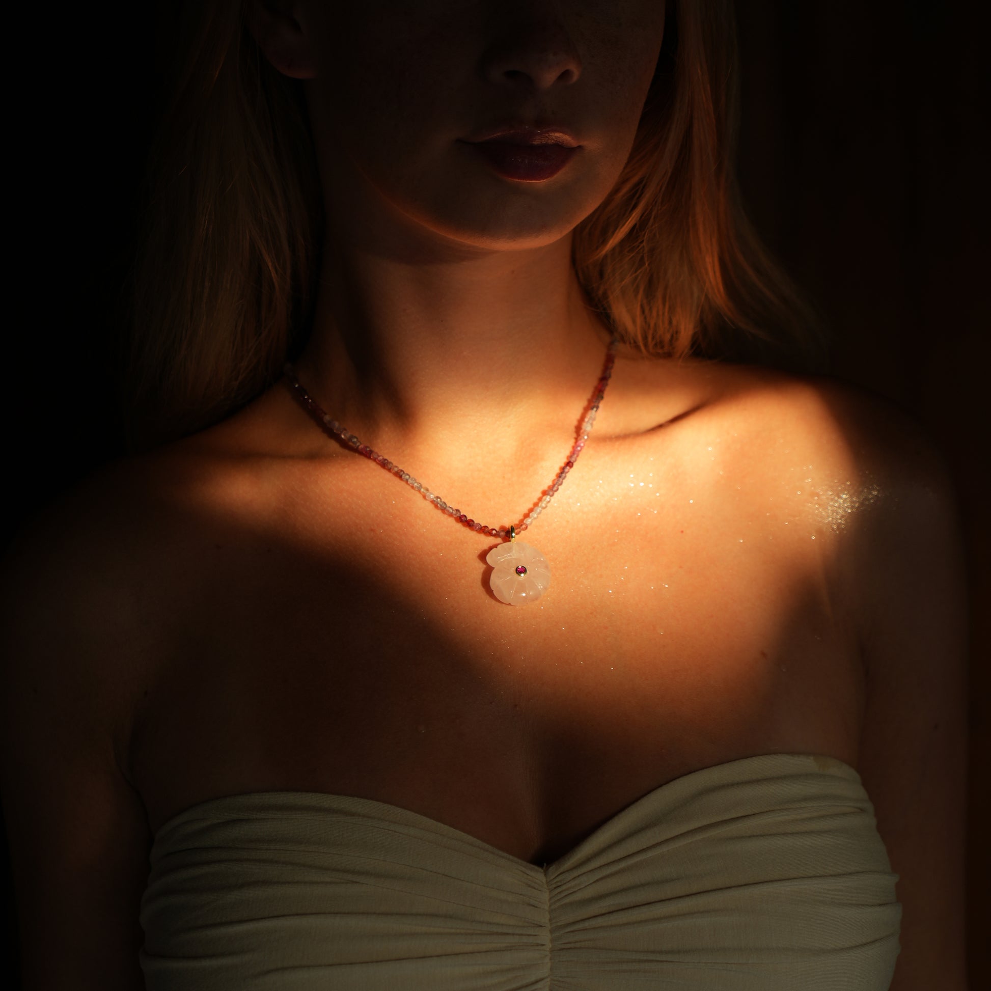 CONCHA necklace from After-Sun Hours, pink beaded strand with a carved rose quartz shell pendant.
