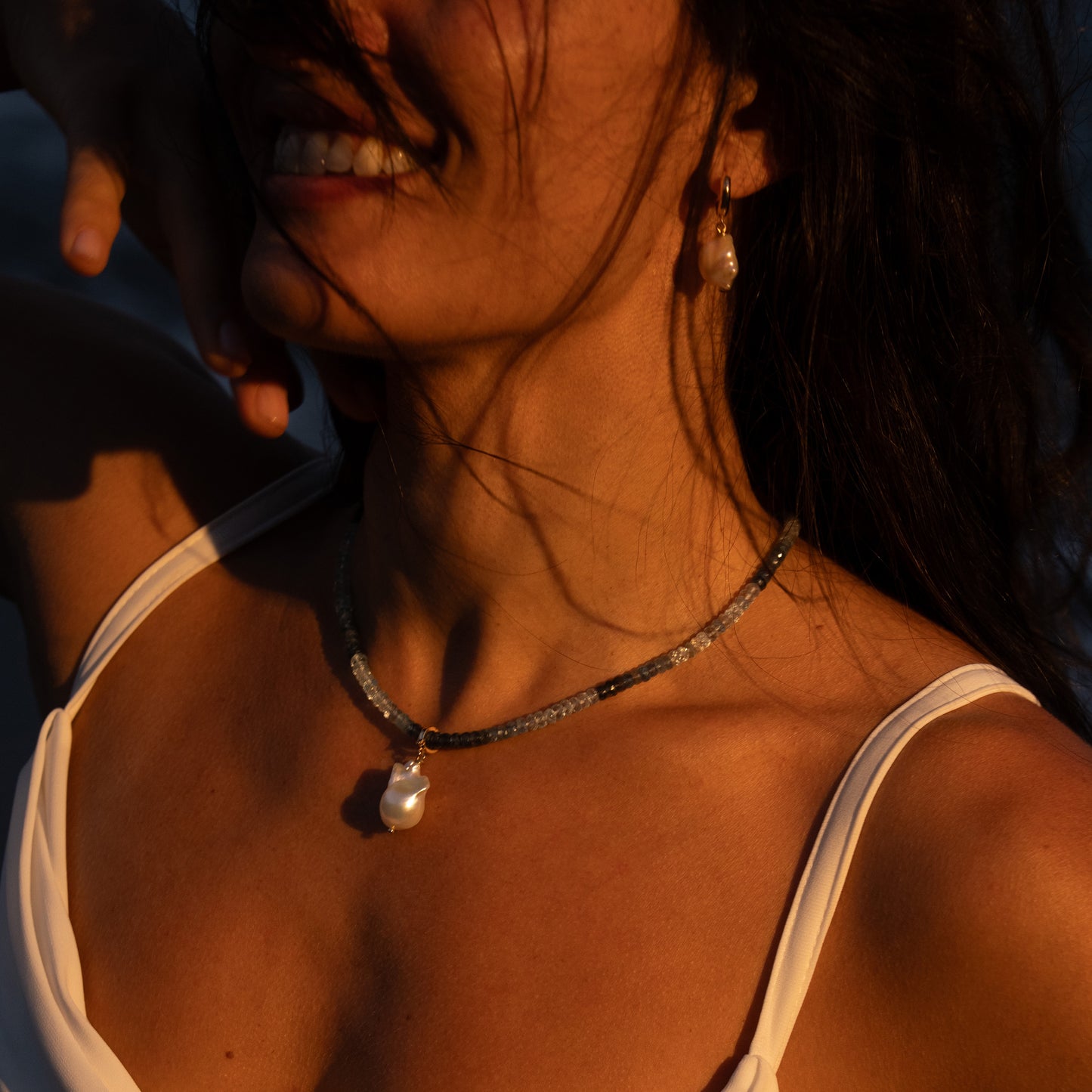 NALU charm from After-Sun Hours, a single baroque pearl on a removable clasp.