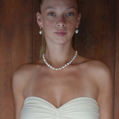 MABE necklace from After-Sun Hours, a strand of peach and pink pearls.