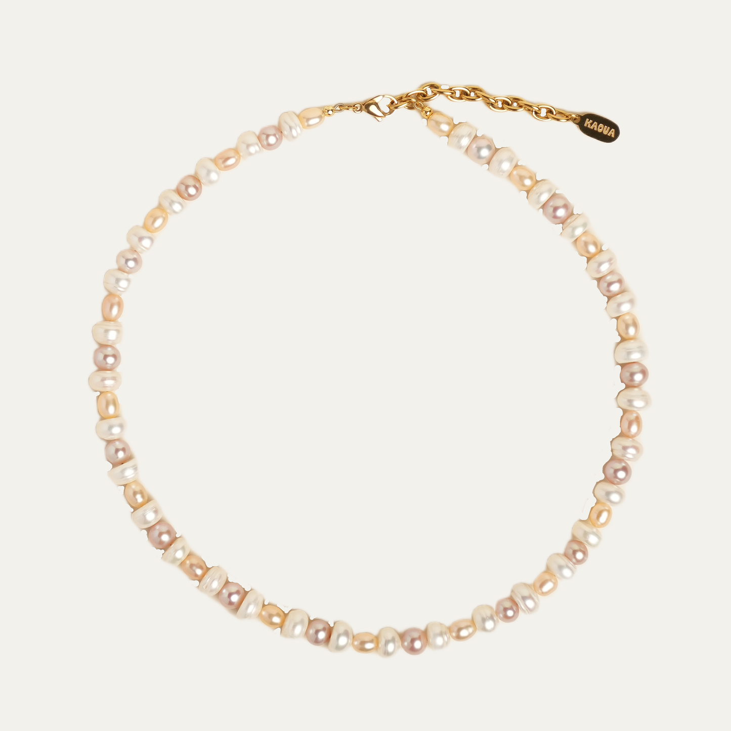 MABE necklace from After-Sun Hours, a strand of peach and pink pearls.
