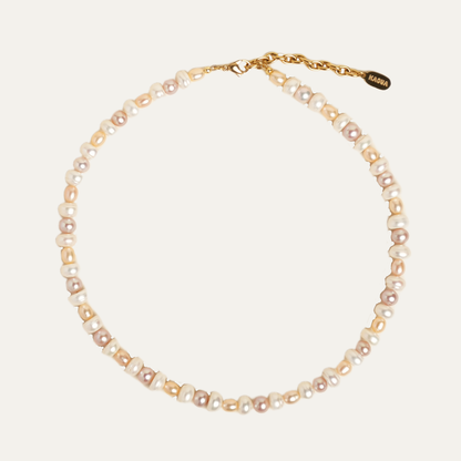 MABE necklace from After-Sun Hours, a strand of peach and pink pearls.