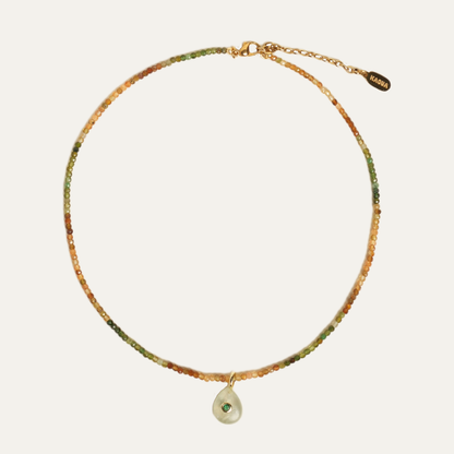 NONI necklace from After-Sun Hours, beads shading from green to gold with a soft green pendant.