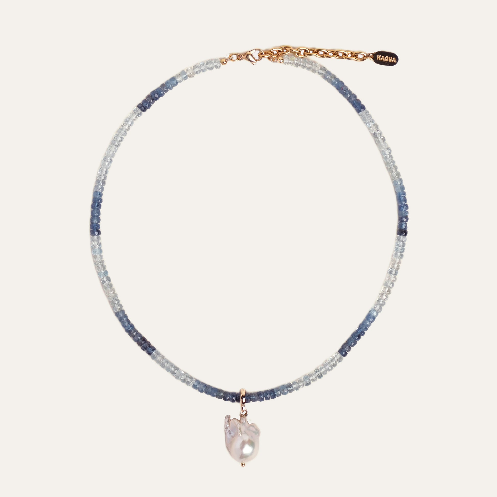 MAREA necklace from After-Sun Hours, a gradient of pale blue beads with a single pearl charm.