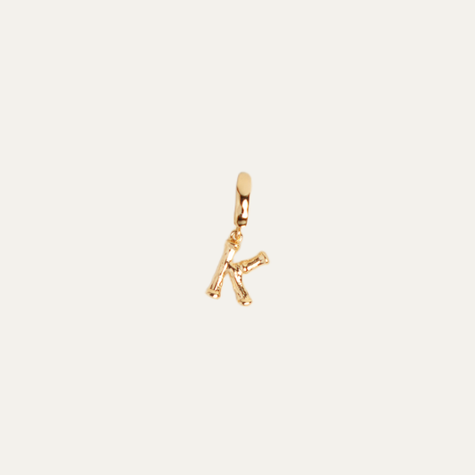CABANA INITIALS charm from After-Sun Hours, gold-plated bamboo letter charm on a removable clasp.